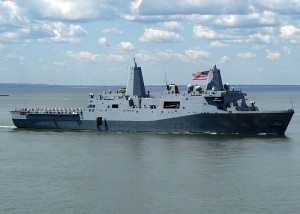 The USS San Antonio entering New York Harbor during Fleet Week, 2006. When I first saw this photo, I thought that the image created the illusion that the ship was holding the Statue of Liberty, but it turns out that is part of the ship's structure and not Liberty's torch that we see. I still can't quite shake that metaphor, however.